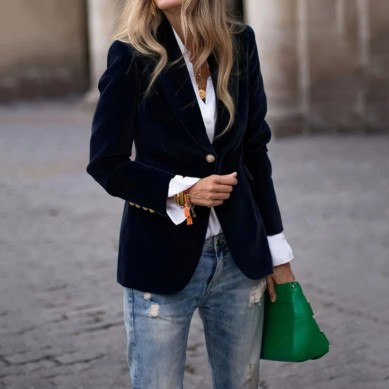 Woman in jeans and velvet blazer