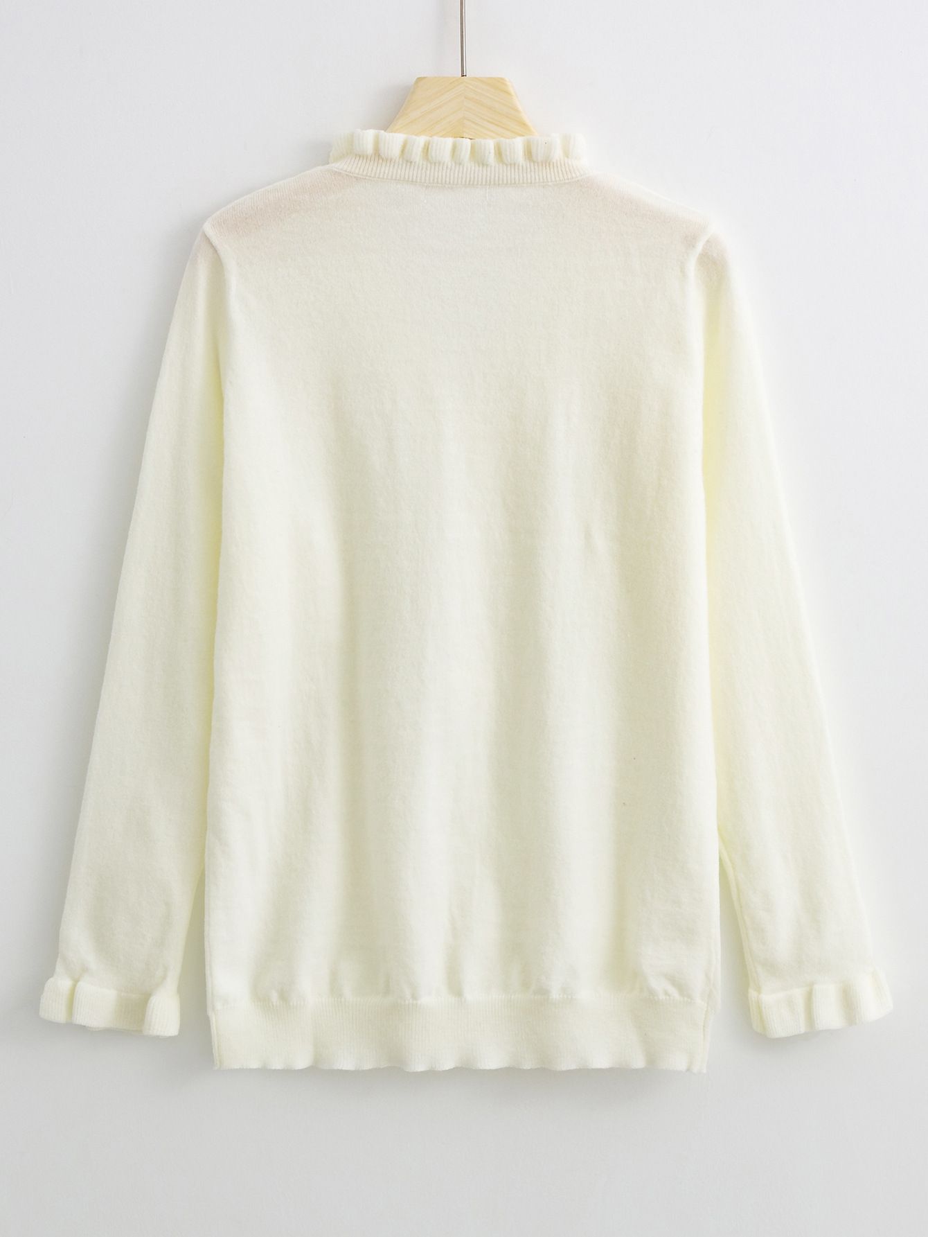Ruffled Sweater with Elegant Buttons