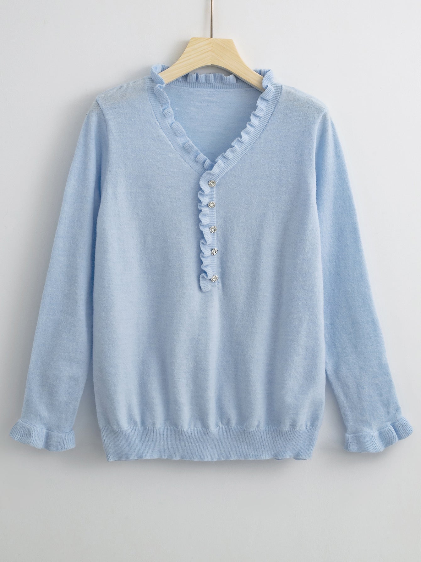 Ruffled Sweater with Elegant Buttons